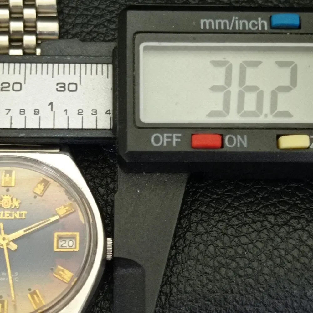 Vintage 1982 Orient Automatic Mens Silver Watch W/daydate & Blue accents